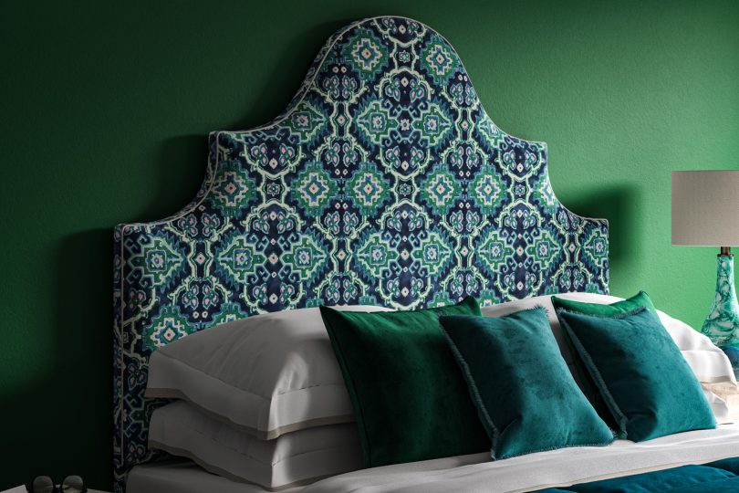 Blue Green Linwood Kami Velvet Seagrass on a curved ornate headboard