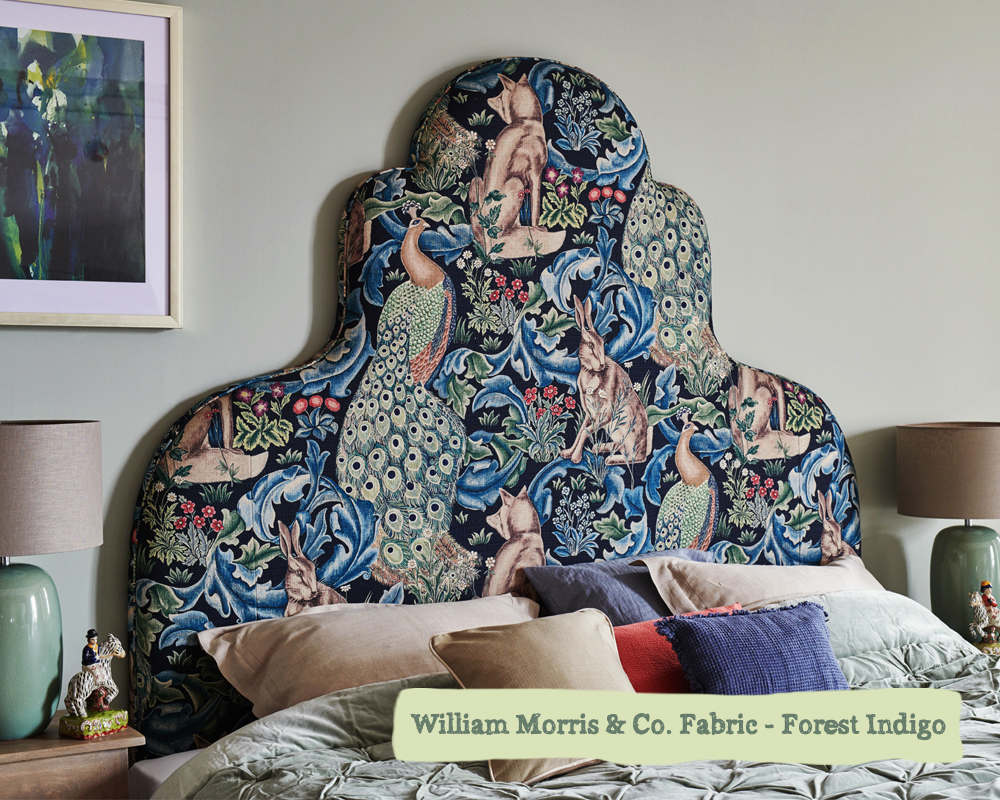 THW - Eigg Headboard - Sanderson Forest Indigo, Self Piped - Angled Shot - LOW RES Rum-Headboard-Porcupine-Rocks-Giraffe-Blossom-Antique-Brass-Nail