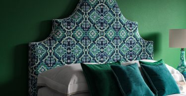 Blue Green Linwood Kami Velvet Seagrass on a curved ornate headboard