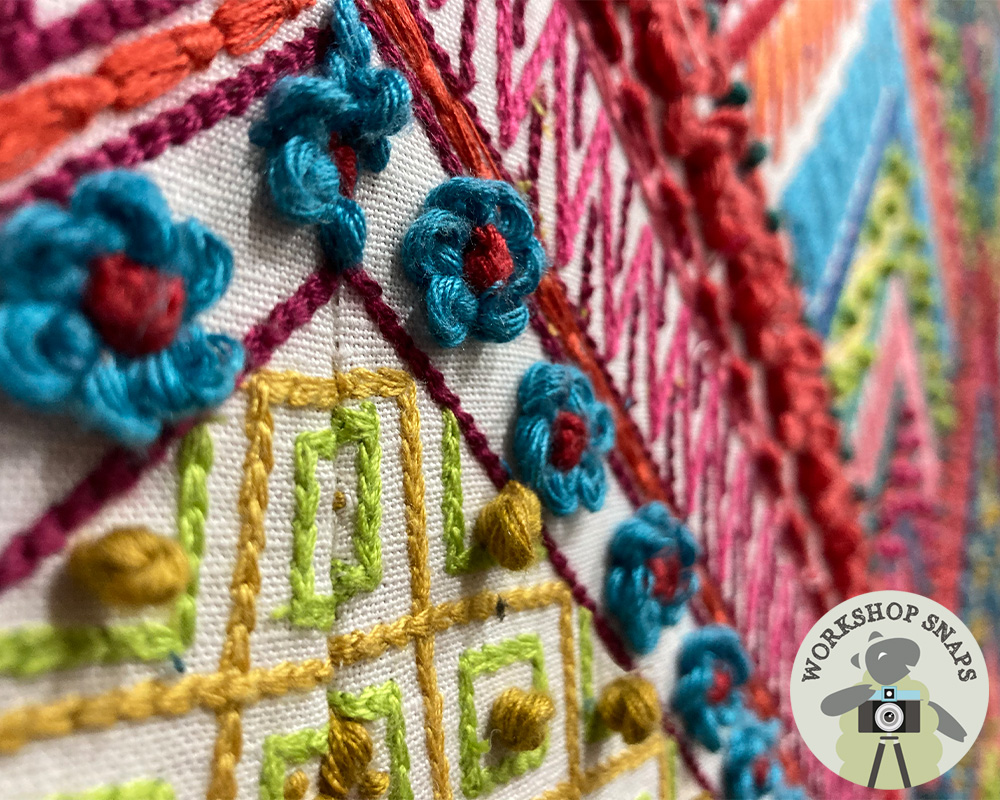 Eigg Keystone Shape Curved Bed upholstered in Manuel Canovas with a Romo Fringe