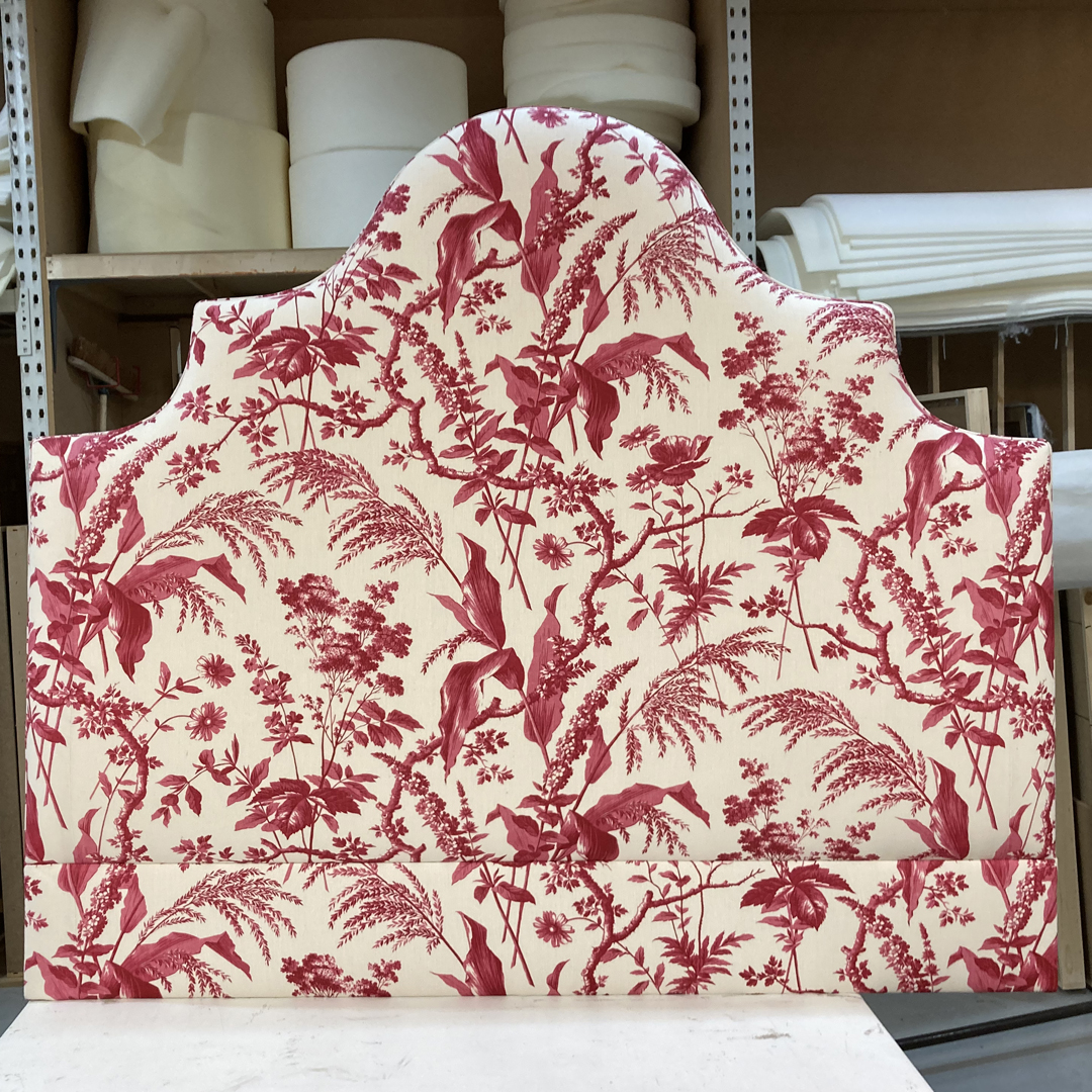 Eigg Keystone Shape Curved Bed upholstered in Manuel Canovas with a Romo Fringe